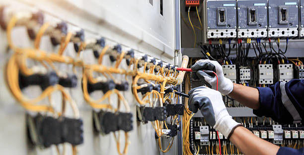 Professional Electrician technician working in Island Walk, FL